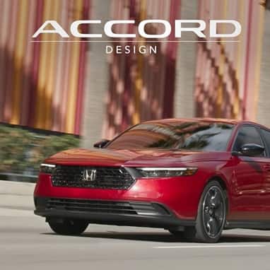 2026 Honda Accord Touring Hybird in Radiant Red Metallic in minimalistic urban environment.